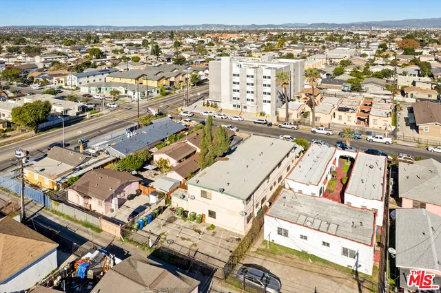 an aerial view of residential houses with city view