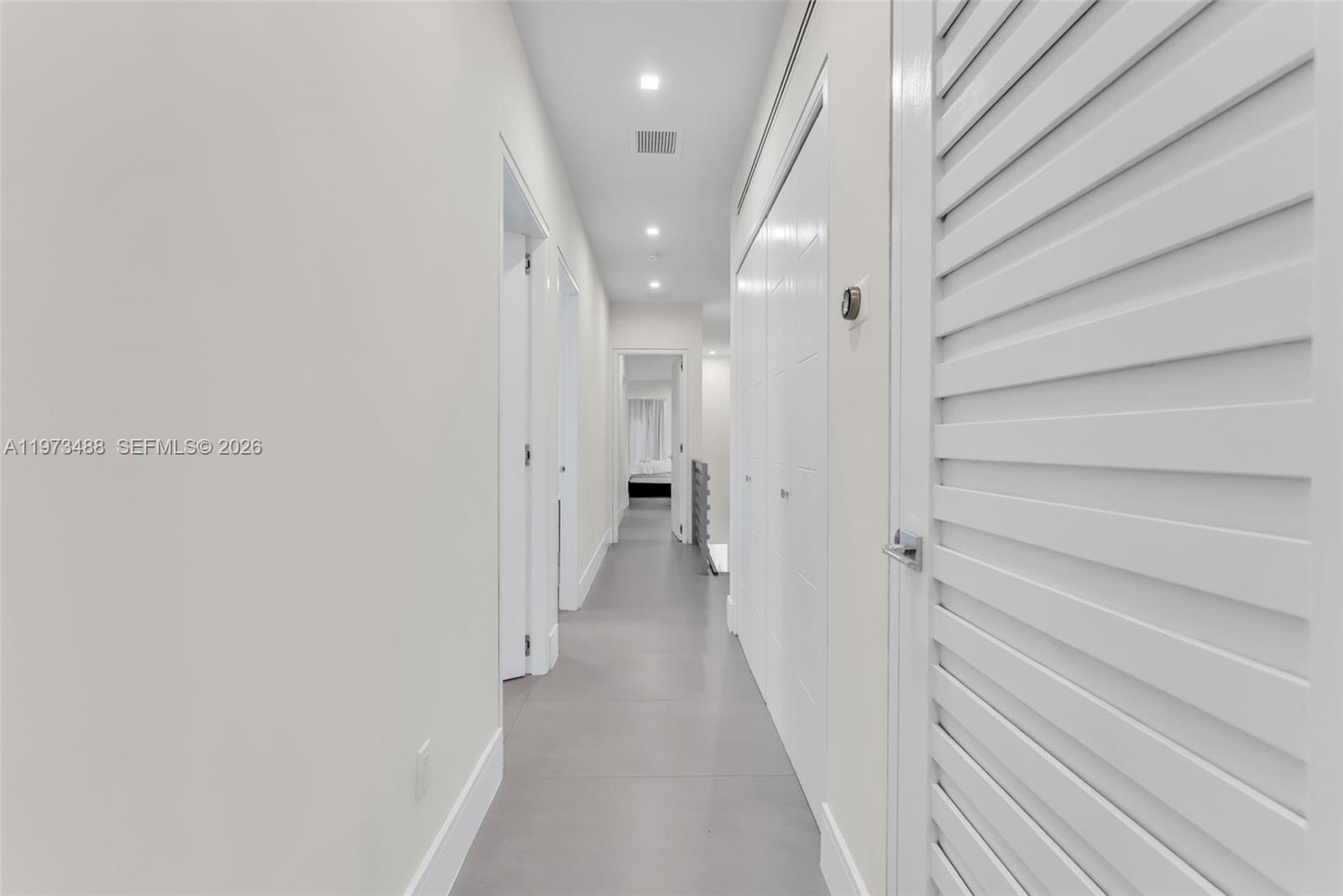 3055 Carter Street, Unit 3055 Miami, FL 33133 - Photo 15 of 32 a view of a hallway with wooden floor and staircase