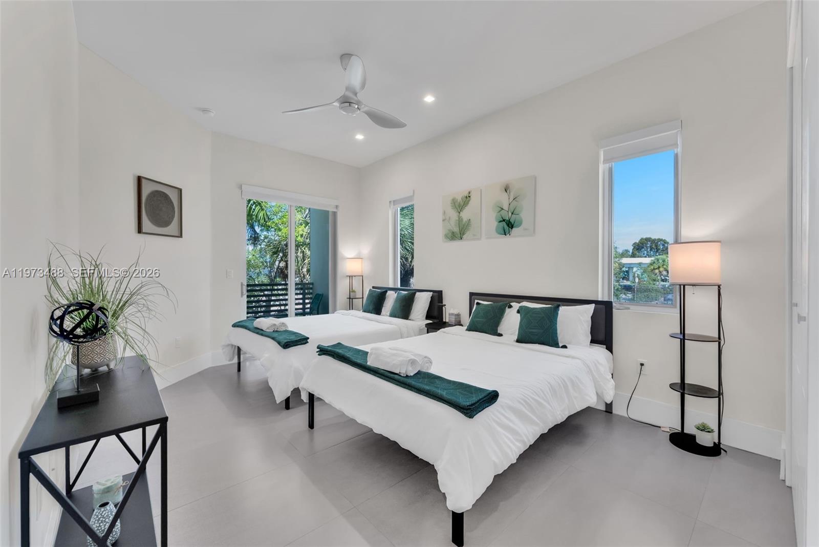 3055 Carter Street, Unit 3055 Miami, FL 33133 - Photo 16 of 32 a living room with a bed furniture and a window