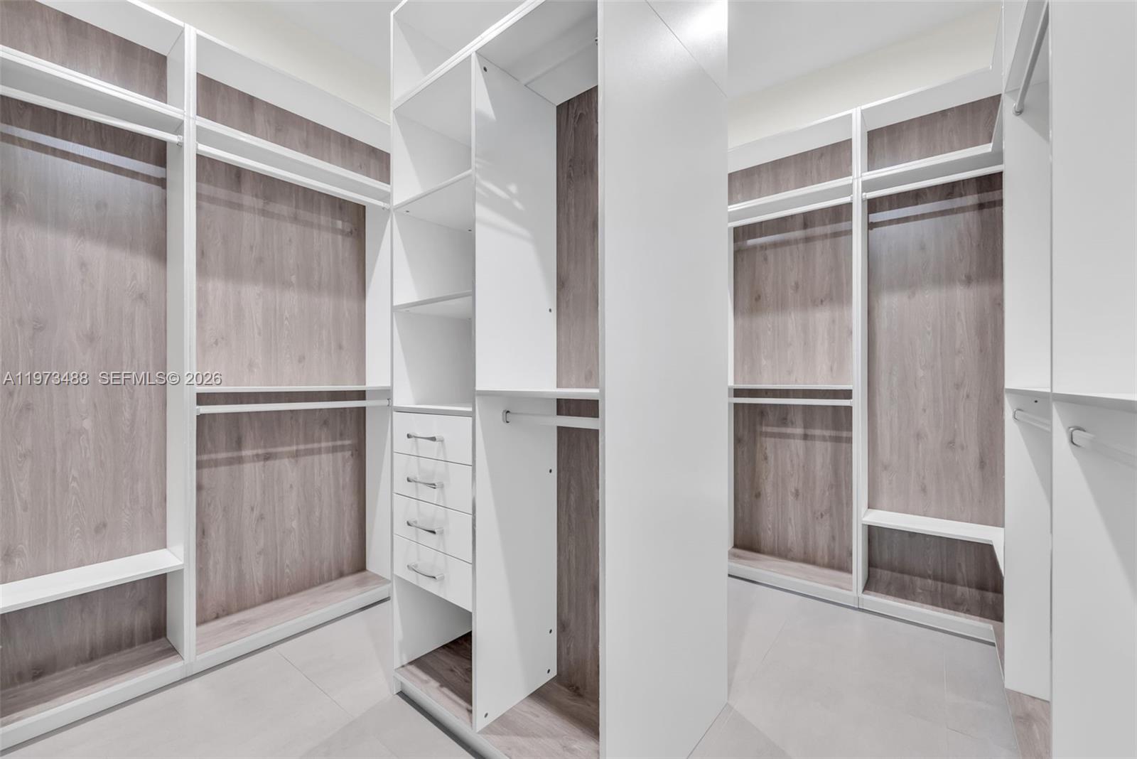 3055 Carter Street, Unit 3055 Miami, FL 33133 - Photo 20 of 32 a view of walk in closet with empty racks