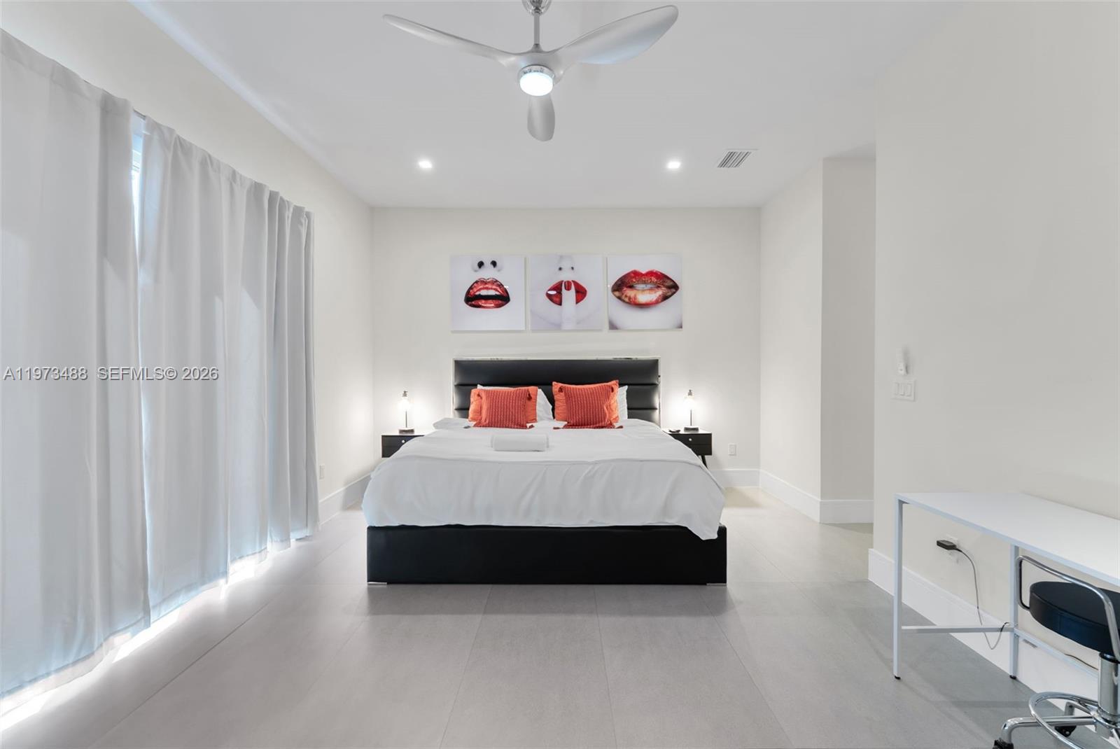 3055 Carter Street, Unit 3055 Miami, FL 33133 - Photo 23 of 32 a bedroom with a bed and a table