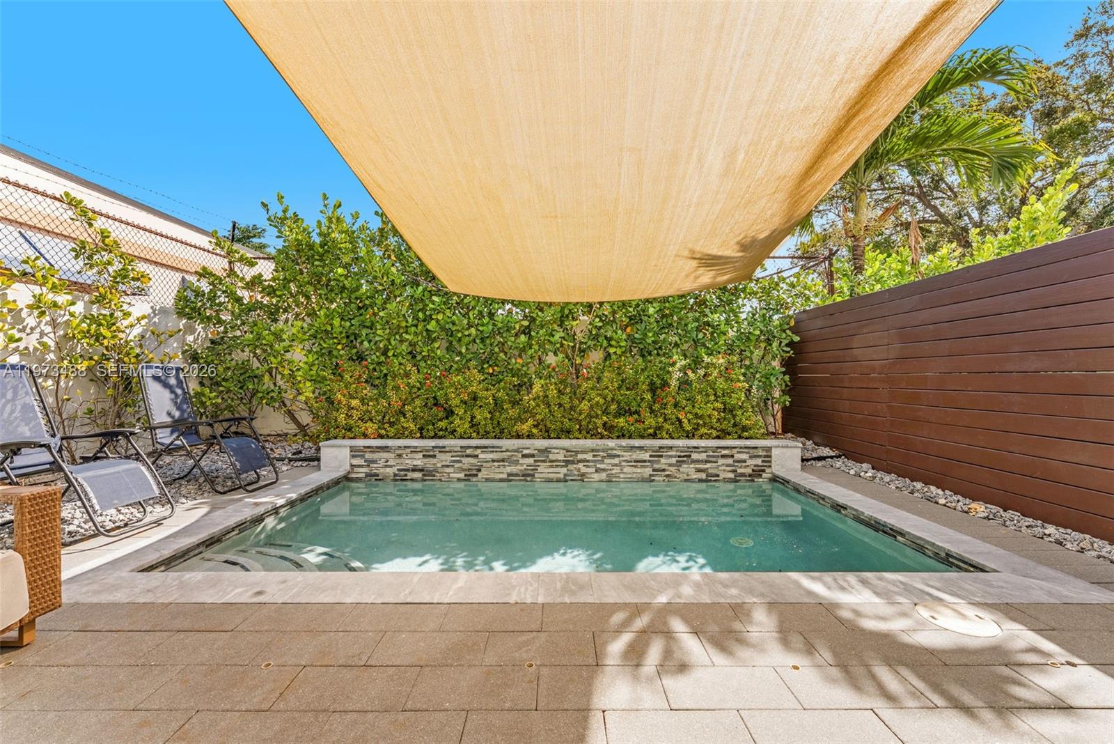 3055 Carter Street, Unit 3055 Miami, FL 33133 - Photo 25 of 32 a view of a back yard of the house