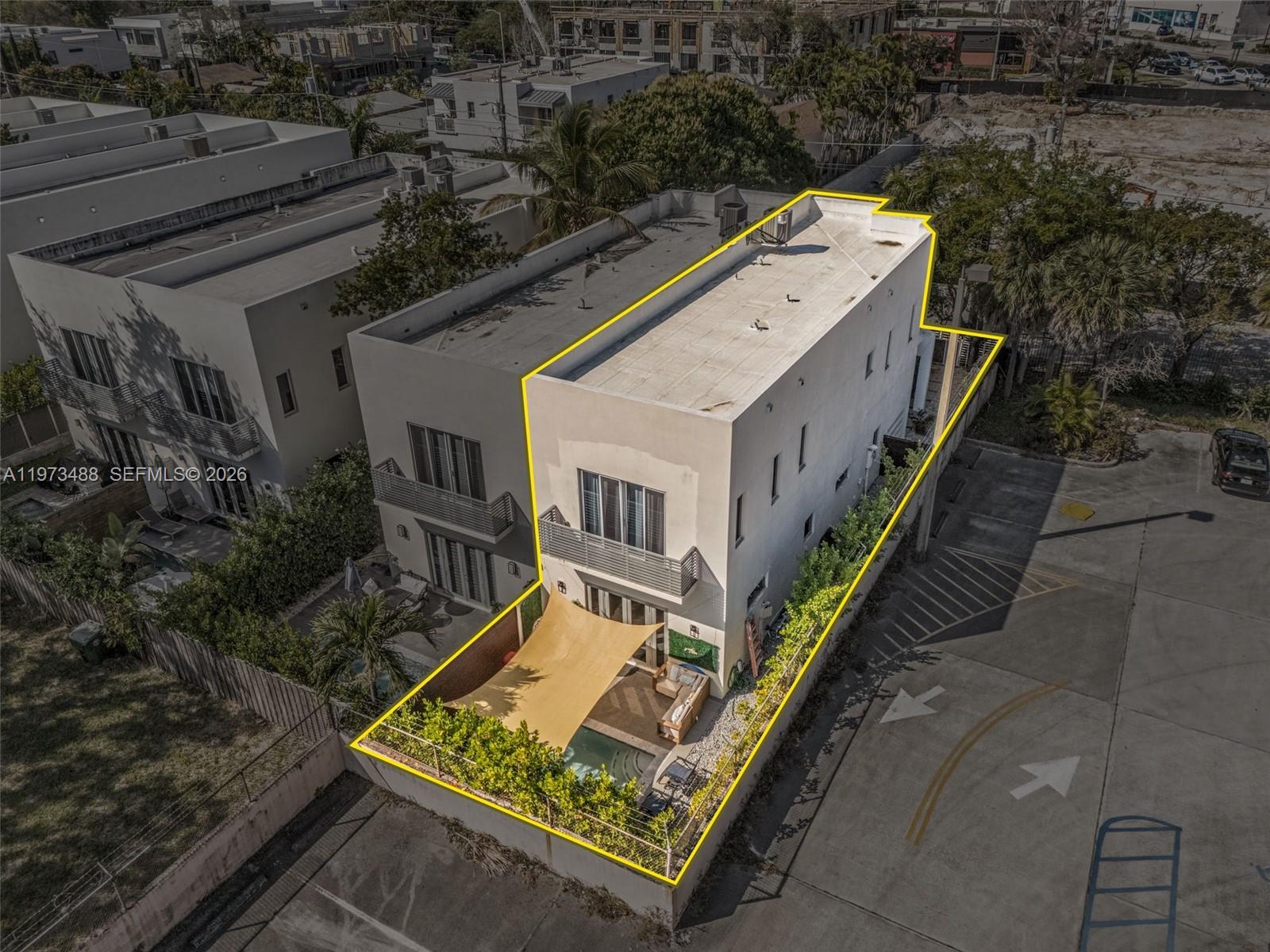 3055 Carter Street, Unit 3055 Miami, FL 33133 - Photo 31 of 32 a aerial view of a house with a yard