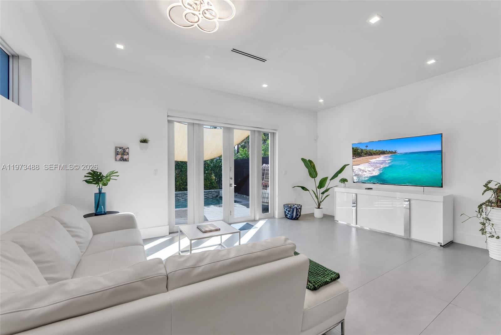 3055 Carter Street, Unit 3055 Miami, FL 33133 - Photo 8 of 32 a living room with furniture and a large window