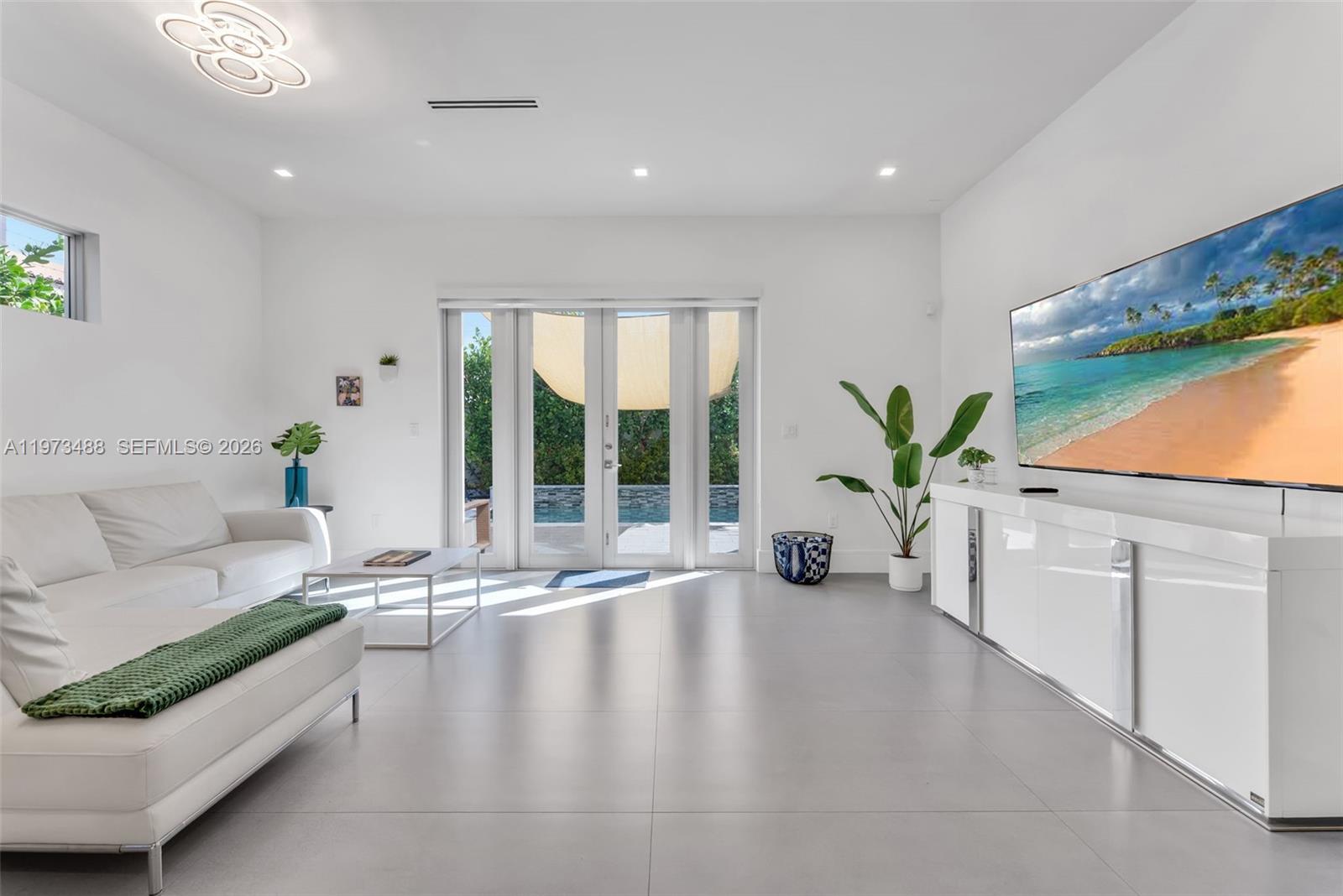 3055 Carter Street, Unit 3055 Miami, FL 33133 - Photo 9 of 32 a living room with furniture and a large window