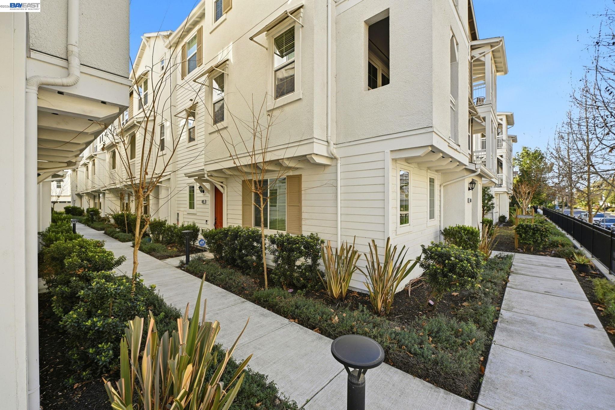 287 Wild Rose Way Milpitas, CA 95035 - Photo 1 of 45 a front view of a house with garden