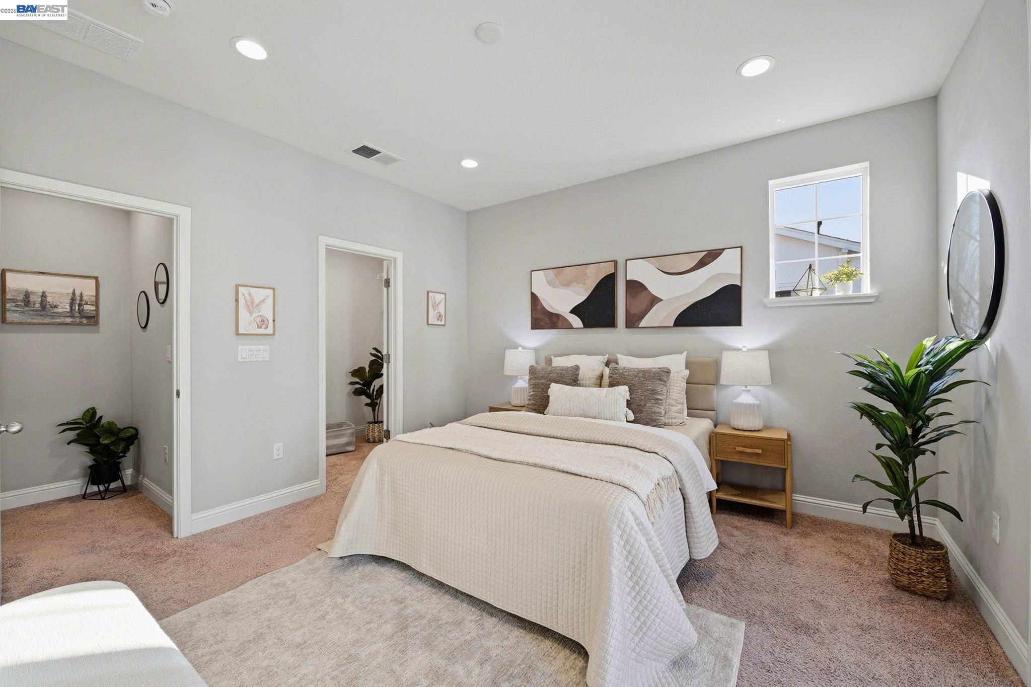 287 Wild Rose Way Milpitas, CA 95035 - Photo 24 of 45 a bedroom with a large bed and potted plant
