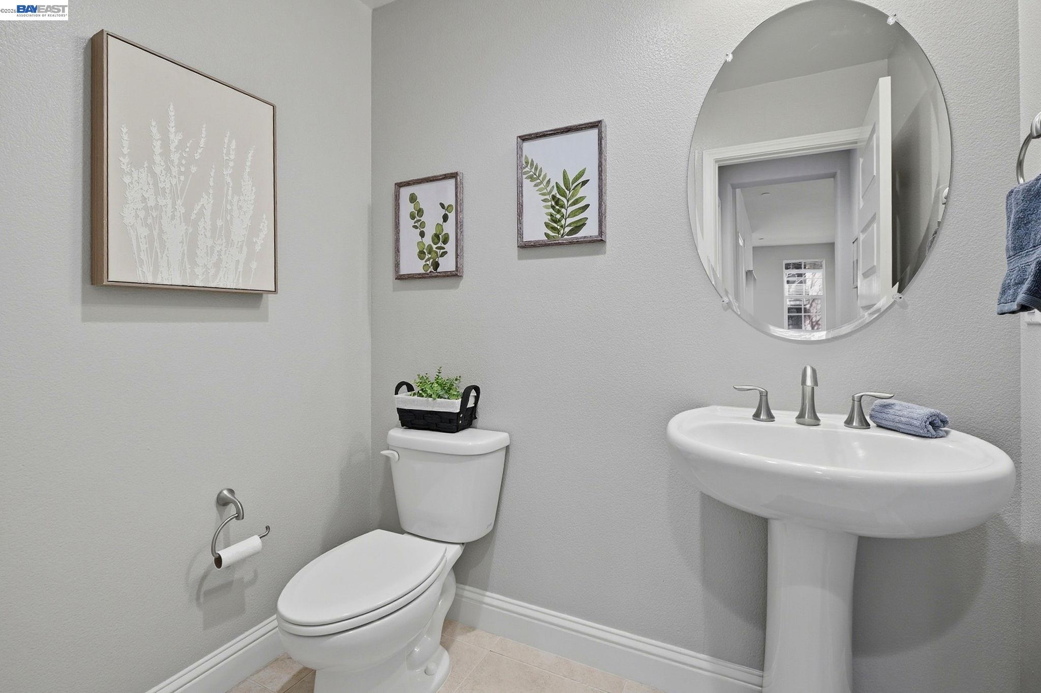 287 Wild Rose Way Milpitas, CA 95035 - Photo 28 of 45 a bathroom with a toilet sink and mirror