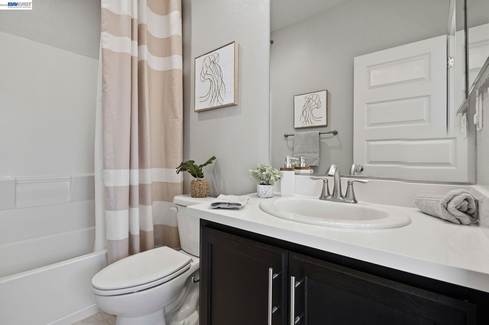 287 Wild Rose Way Milpitas, CA 95035 - Photo 29 of 45 a bathroom with a sink a toilet and shower