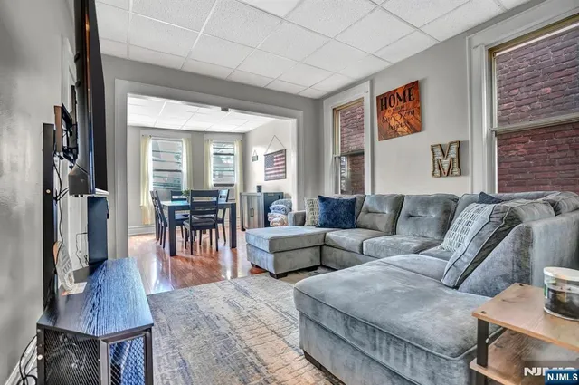 a living room with furniture and a fireplace