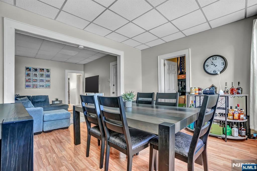 699 Elm Street Kearny, NJ 07032 - Photo 18 of 37 a view of a dining room with furniture and wooden floor
