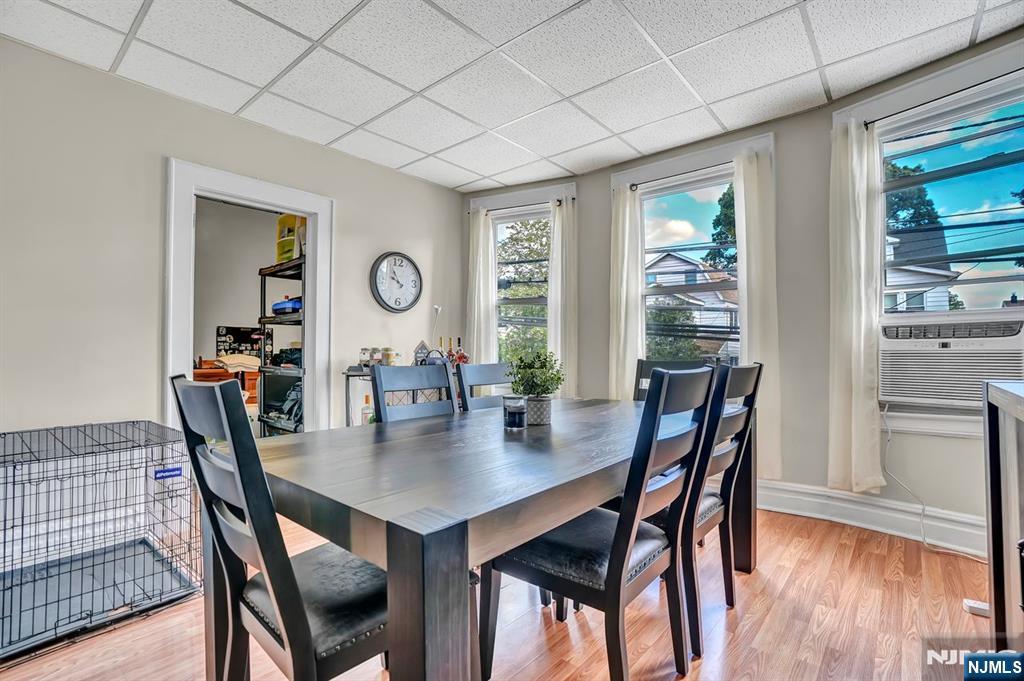 699 Elm Street Kearny, NJ 07032 - Photo 20 of 37 a view of a dining room with furniture and wooden floor