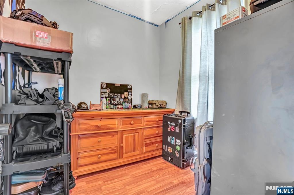 699 Elm Street Kearny, NJ 07032 - Photo 21 of 37 a room with a closet and a mirror