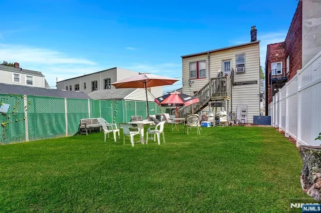 a view of a house with a yard porch and sitting area