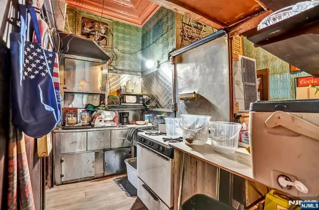 a kitchen with stainless steel appliances granite countertop a sink and cabinets