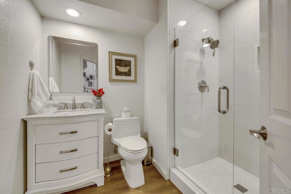 5068 Nighthawk Way Oceanside, CA 92056 - Photo 17 of 39 a bathroom with a sink toilet a shower and a mirror