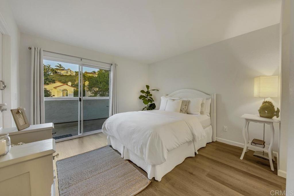 5068 Nighthawk Way Oceanside, CA 92056 - Photo 20 of 39 a bedroom with a bed and a window