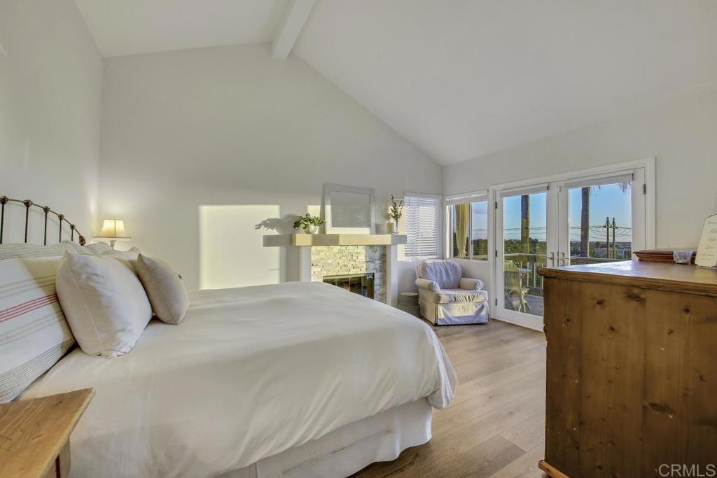 5068 Nighthawk Way Oceanside, CA 92056 - Photo 23 of 39 a bedroom with a large bed and a view of bedroom