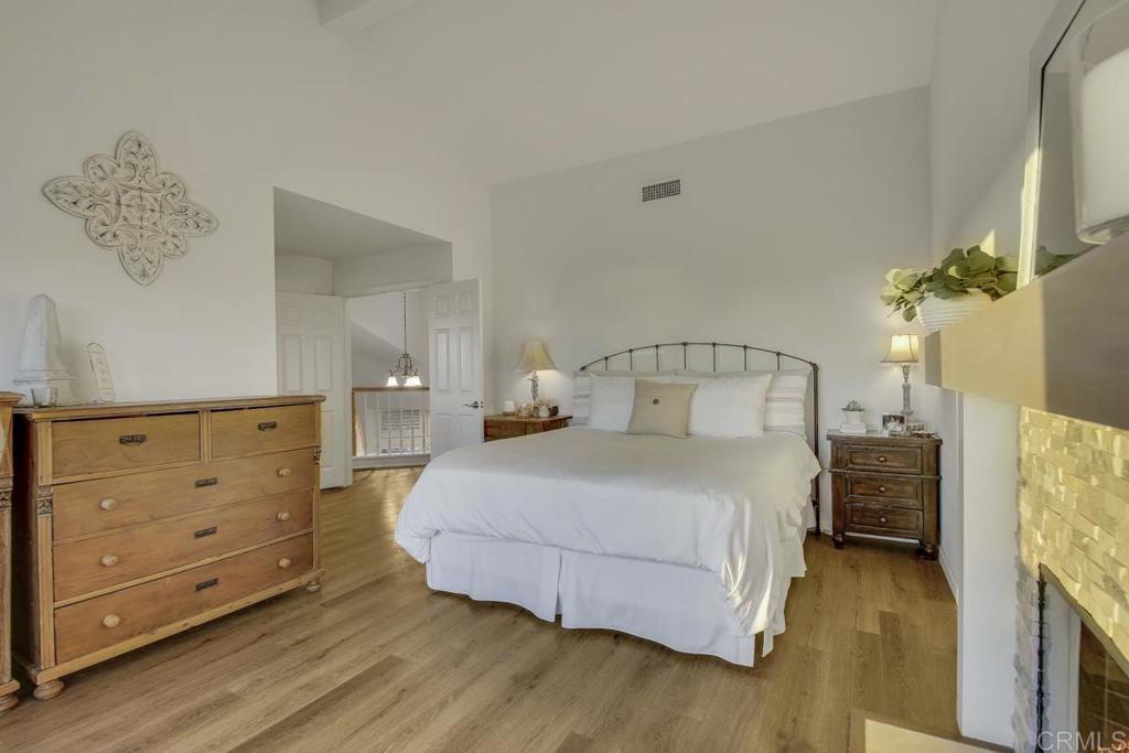 5068 Nighthawk Way Oceanside, CA 92056 - Photo 24 of 39 a bedroom with a bed and a dresser