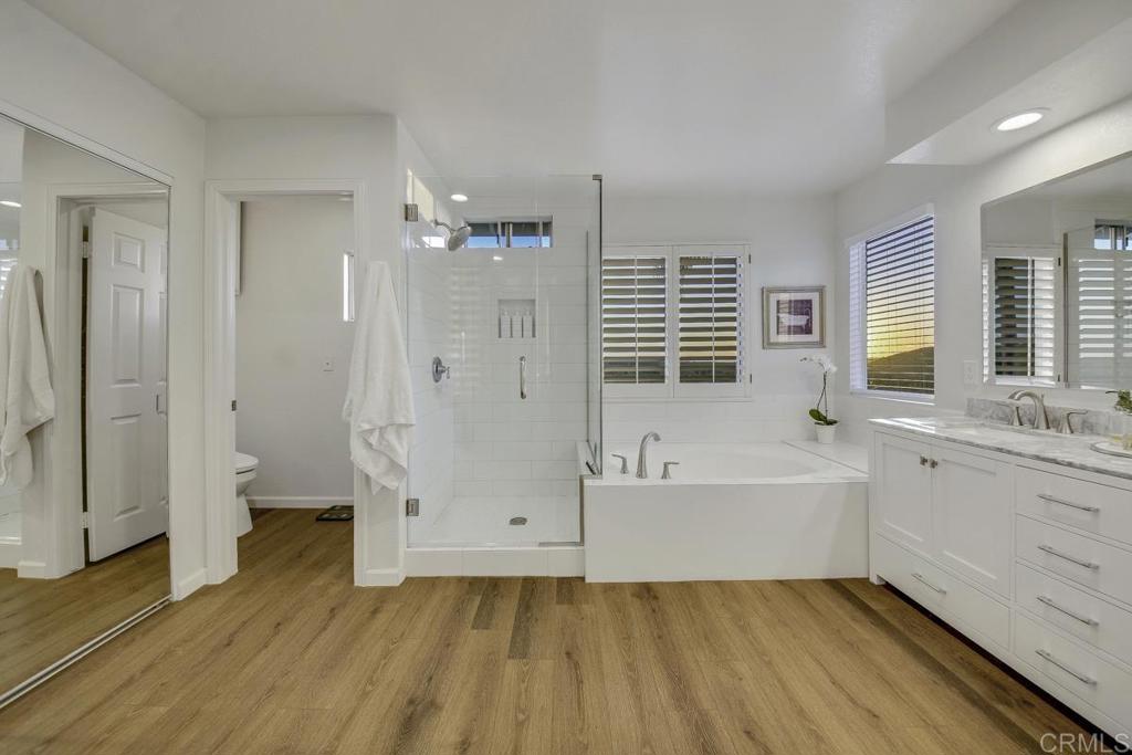 5068 Nighthawk Way Oceanside, CA 92056 - Photo 27 of 39 a bathroom with a tub sink and a shower