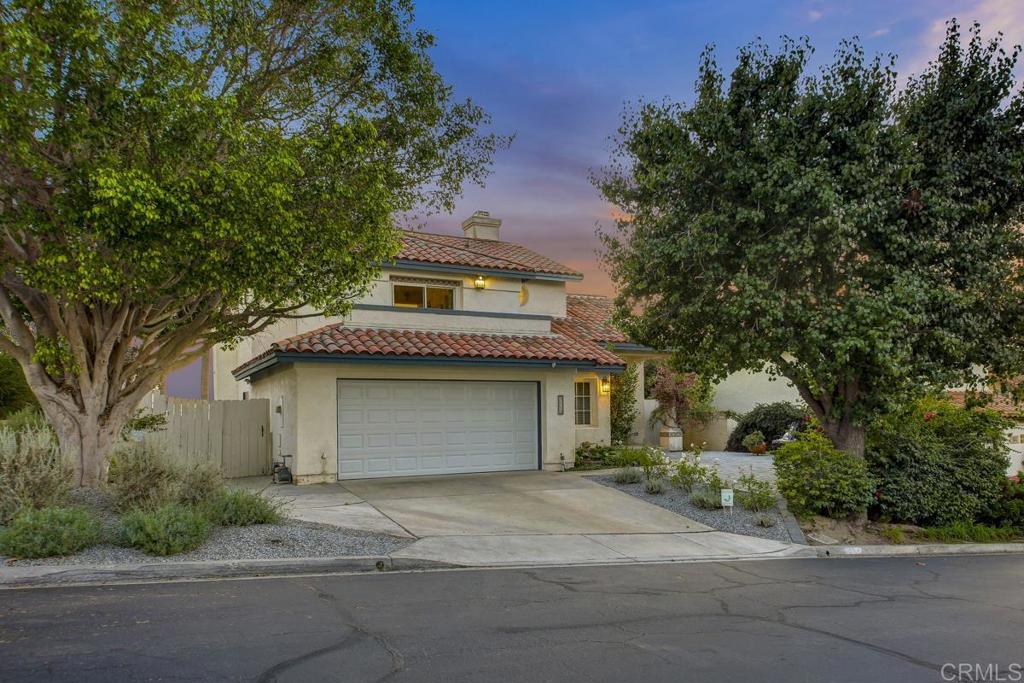 5068 Nighthawk Way Oceanside, CA 92056 - Photo 3 of 39 a front view of house with yard and trees
