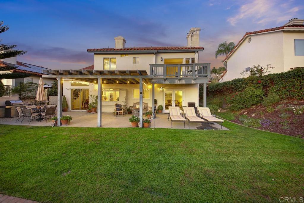 5068 Nighthawk Way Oceanside, CA 92056 - Photo 32 of 39 a view of a house with a big yard and sitting area