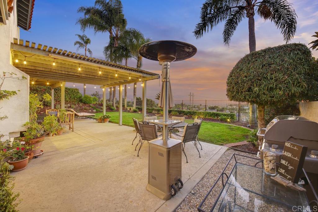 5068 Nighthawk Way Oceanside, CA 92056 - Photo 34 of 39 a patio with a table and chairs and a barbeque