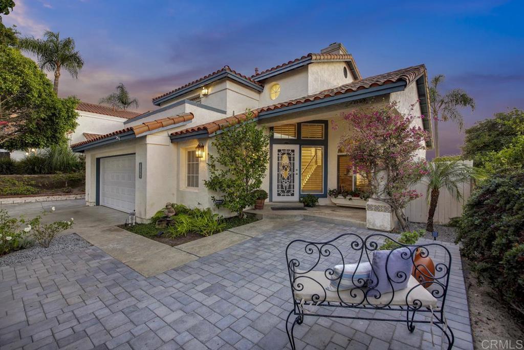 5068 Nighthawk Way Oceanside, CA 92056 - Photo 4 of 39 a front view of a house with garden