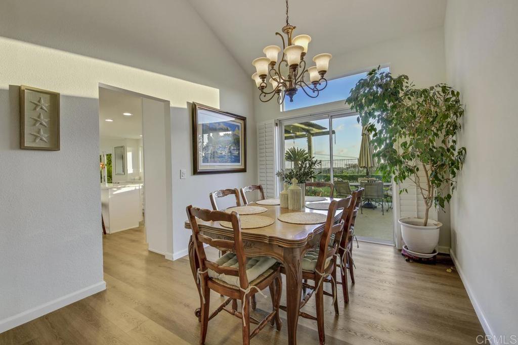 5068 Nighthawk Way Oceanside, CA 92056 - Photo 9 of 39 a view of a dining room with furniture and chandelier