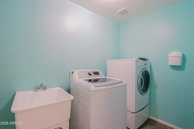 a utility room with dryer and washer