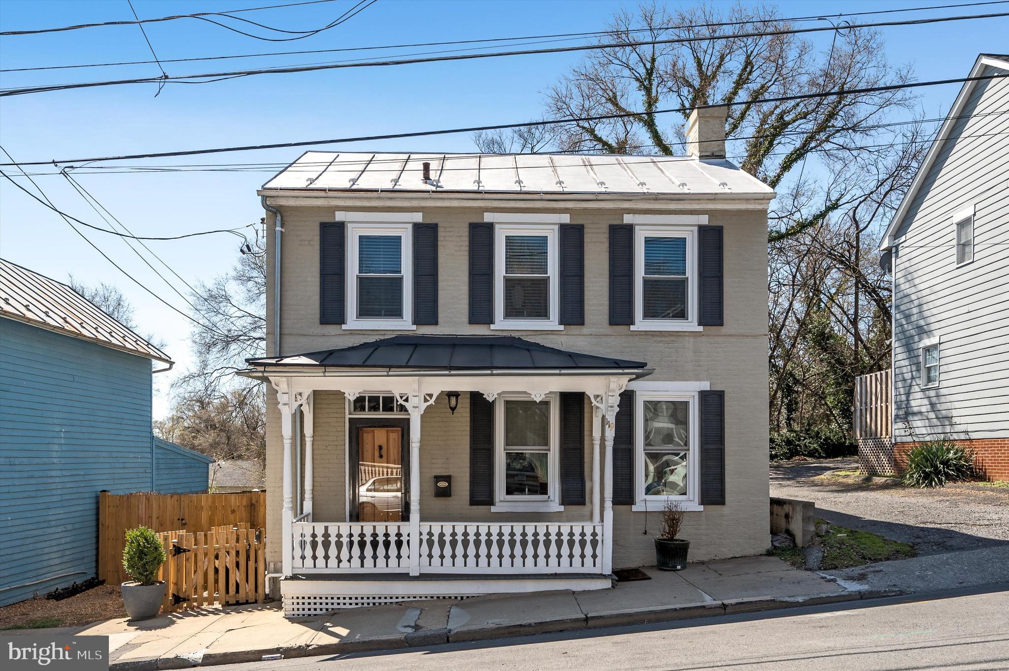 119 East Germain Street Winchester, VA 22601 - Photo 1 of 48 a view of a brick house with a porch