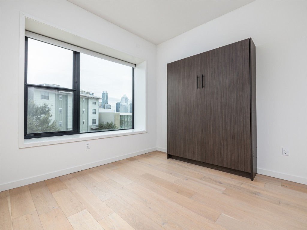 800 Embassy Drive, Unit 237 Austin, TX 78702 - Photo 17 of 35 Guest bedroom with murphy bed