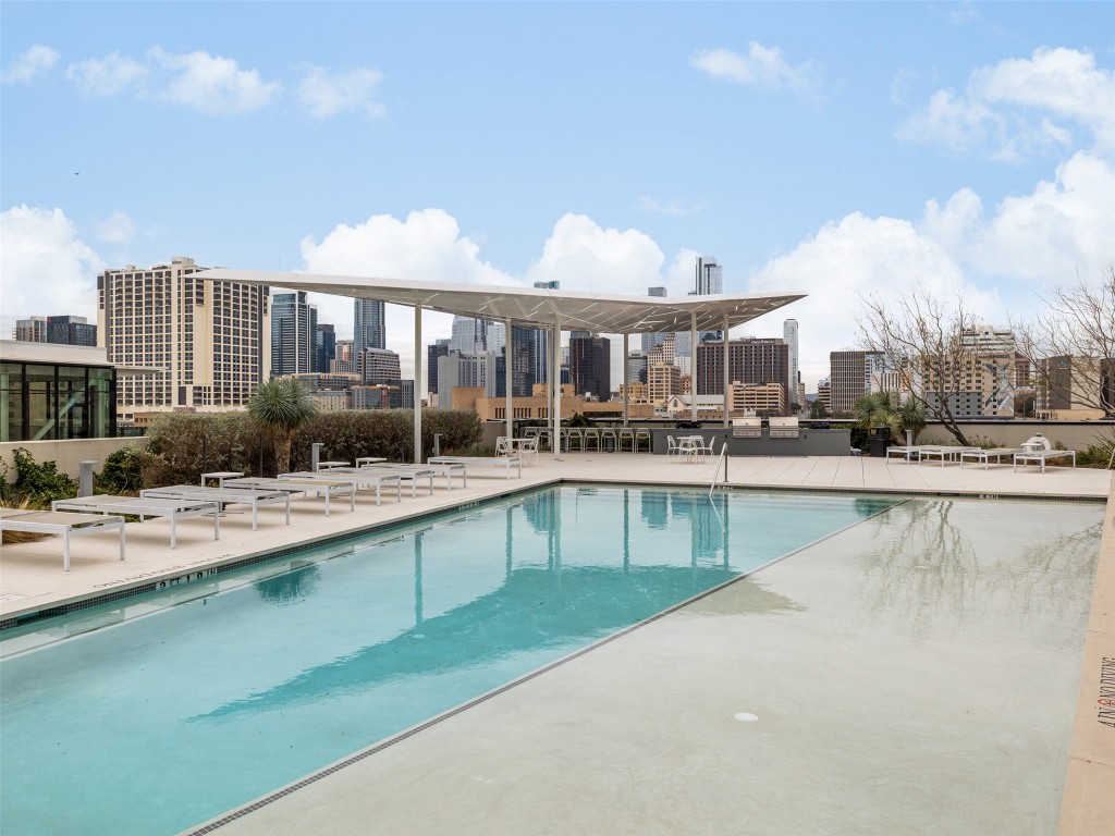 800 Embassy Drive, Unit 237 Austin, TX 78702 - Photo 27 of 35 Community pool with a skyline view and a patio area