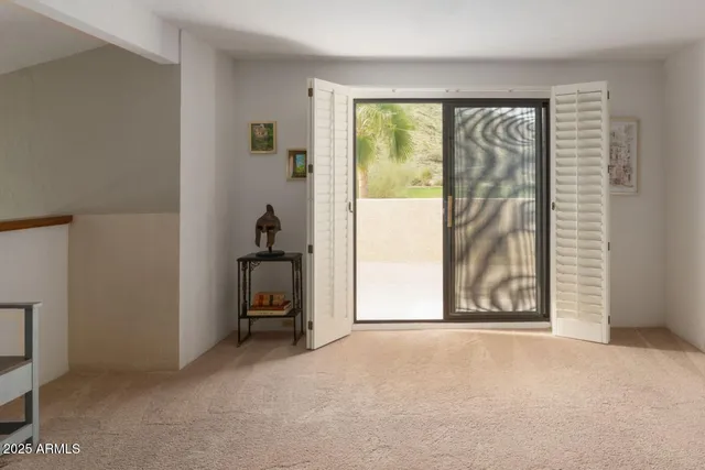 a view of a hallway view with staircase