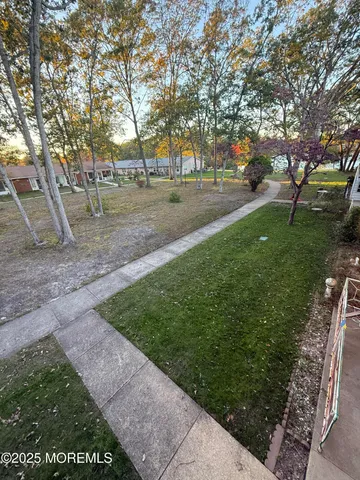 a view of park on side of street