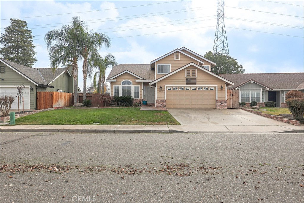 308 Harbor Drive Atwater, CA 95301 - Photo 2 of 58 a front view of a house with a yard and trees