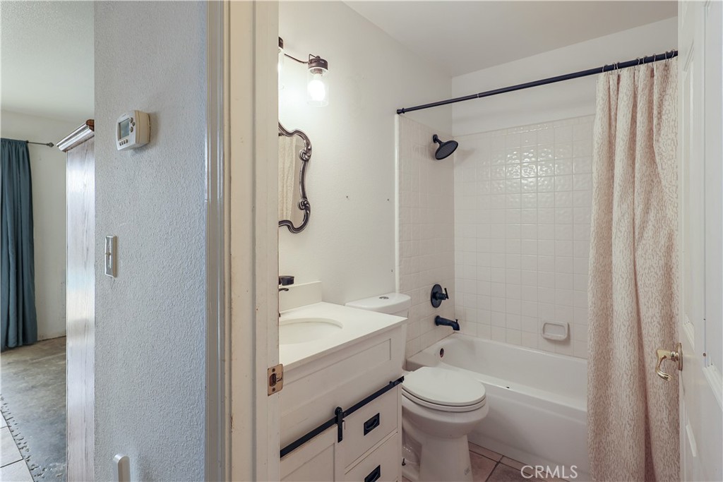 308 Harbor Drive Atwater, CA 95301 - Photo 29 of 58 a bathroom with a sink a toilet and shower