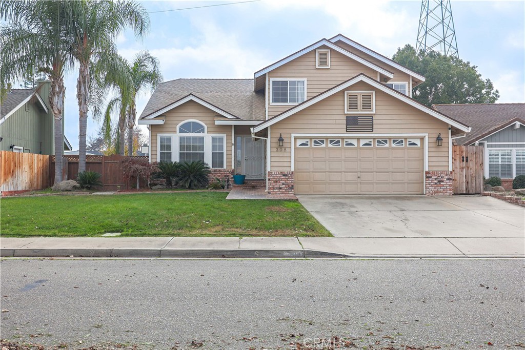 308 Harbor Drive Atwater, CA 95301 - Photo 3 of 58 a front view of a house with a yard and garage