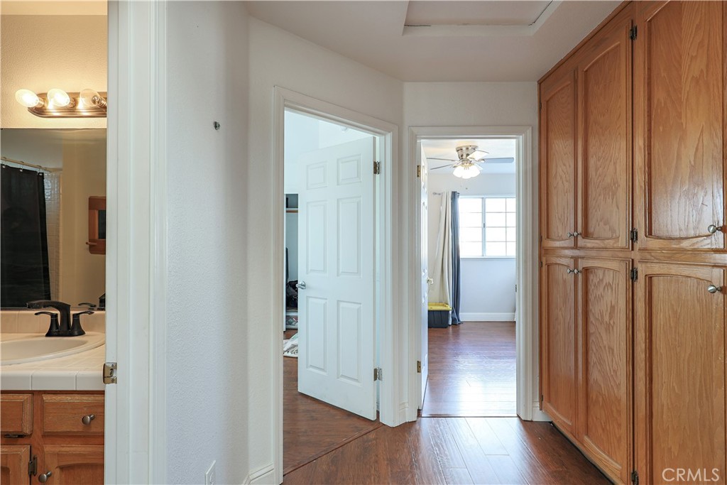 308 Harbor Drive Atwater, CA 95301 - Photo 36 of 58 a view of a hallway with bathroom and wooden floor