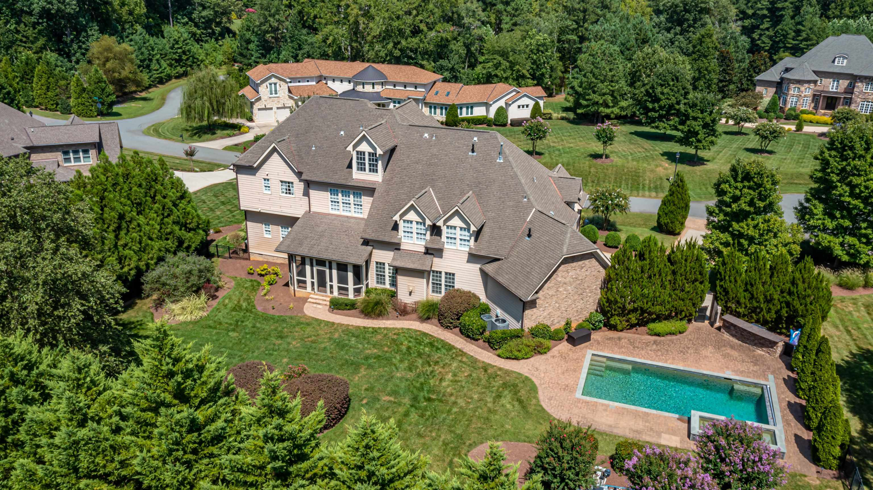 9805 Najma Street Raleigh, NC 27613 - Photo 30 of 30 A view of the home from the rear above...nestled amongst homes of similar caliber in a private gated community. Overview