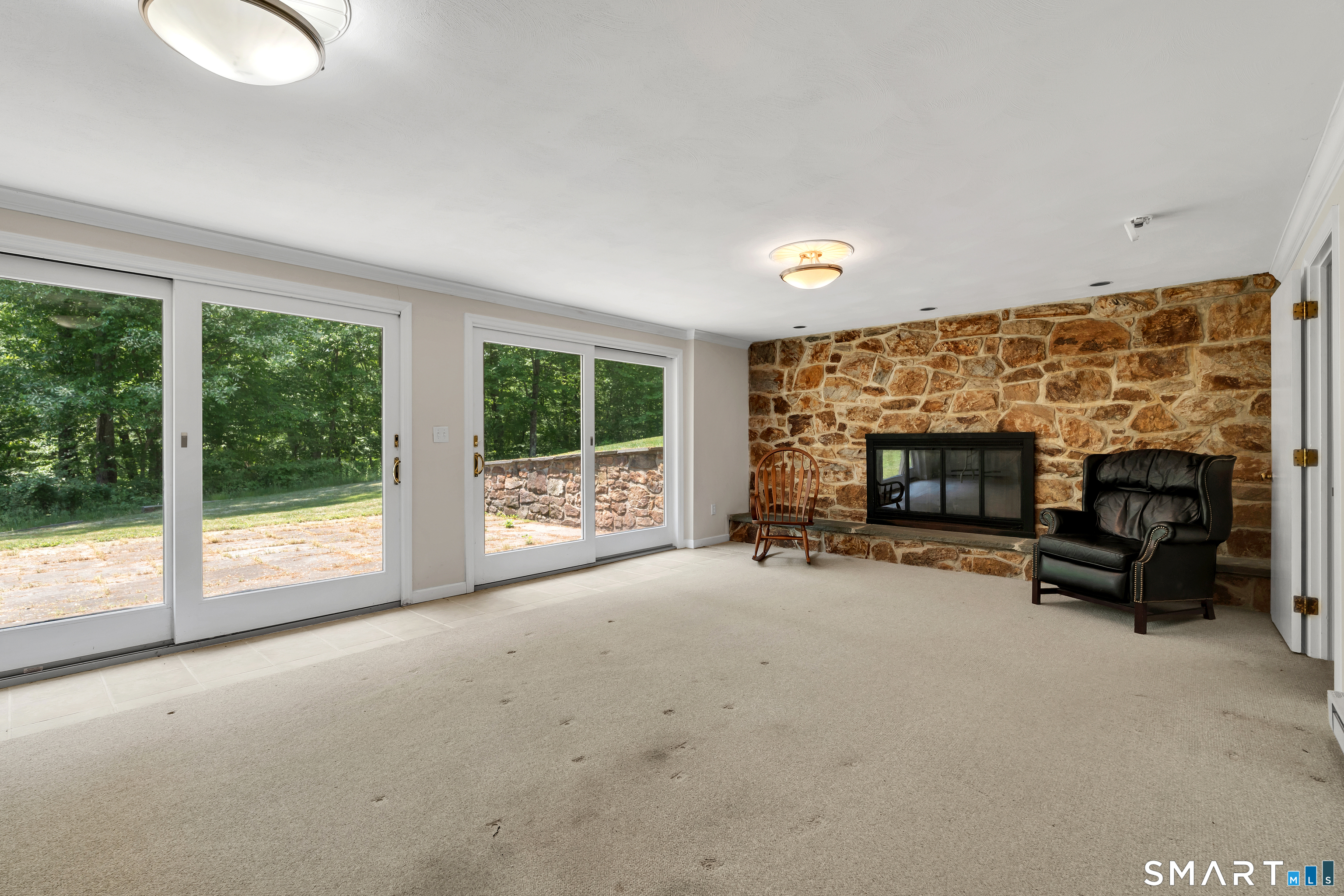 30 Maltbie Road Newtown, CT 06470 - Photo 37 of 40 a view of empty room with furniture and fireplace