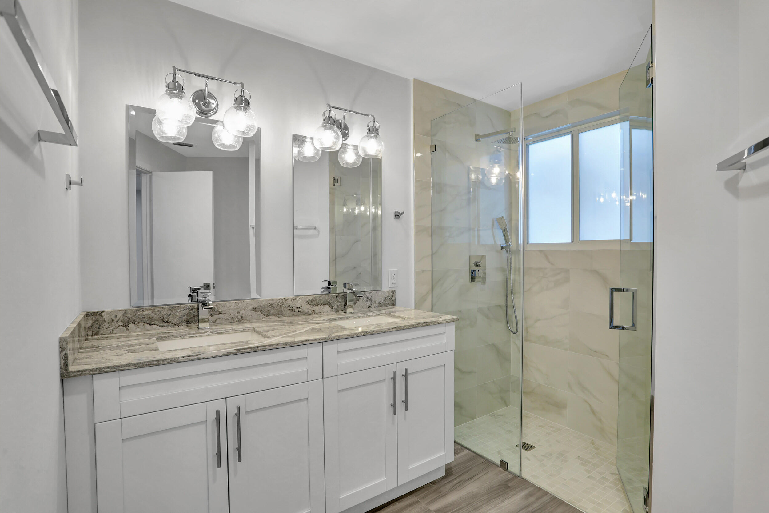 23271 Water Circle Boca Raton, FL 33486 - Photo 15 of 64 a bathroom with a granite countertop sink a large mirror and a shower