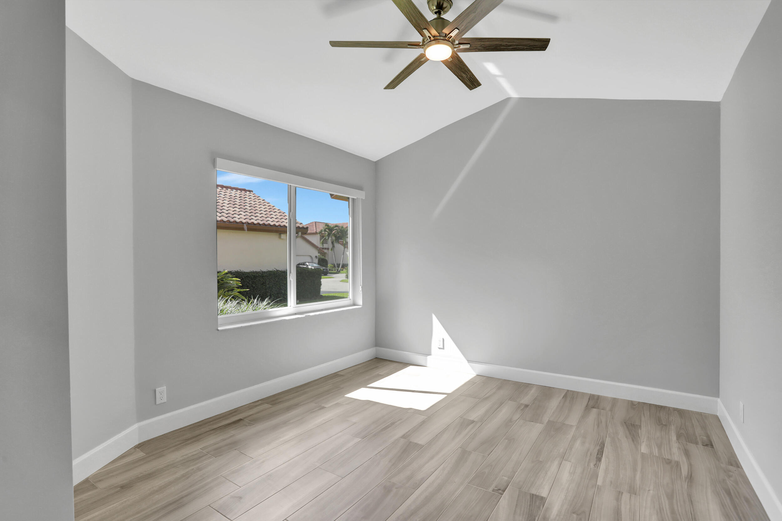 23271 Water Circle Boca Raton, FL 33486 - Photo 20 of 64 a view of a big room with wooden floor and windows in a room