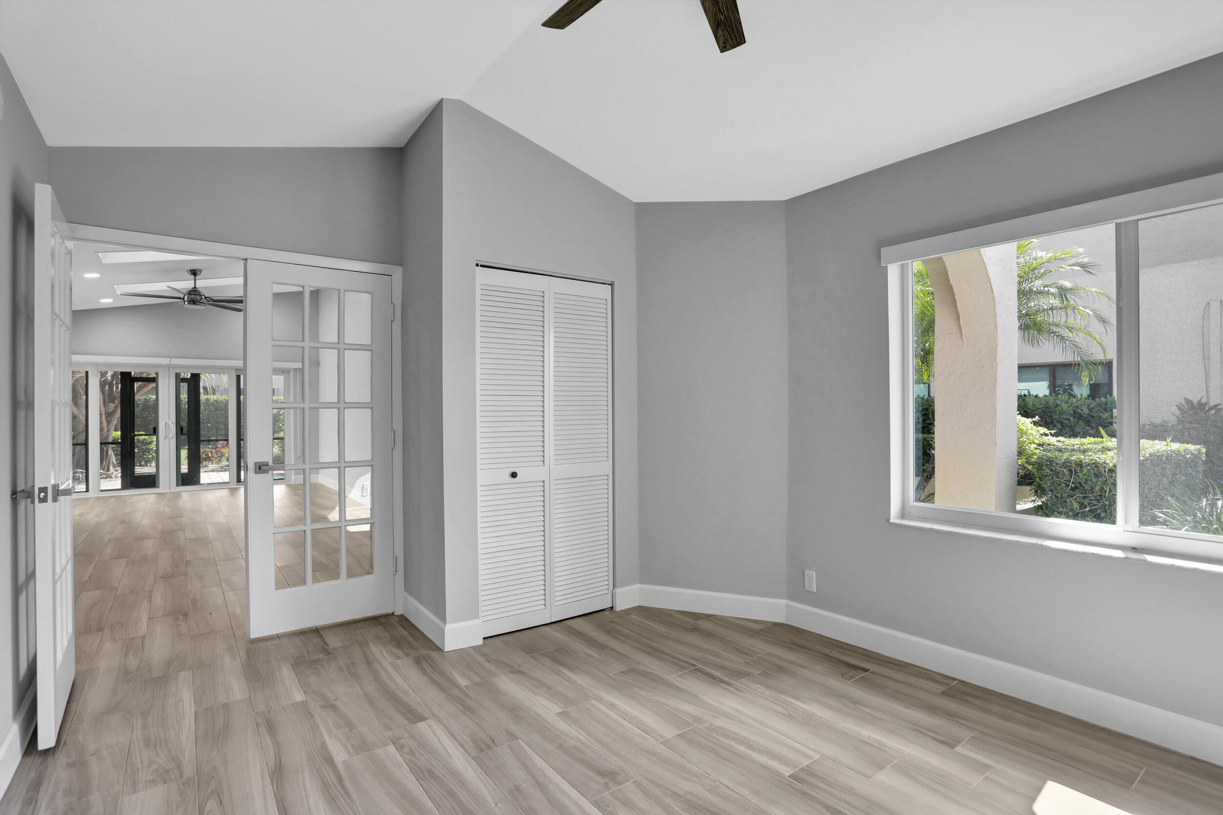23271 Water Circle Boca Raton, FL 33486 - Photo 21 of 64 a view of an empty room with glass door and a window