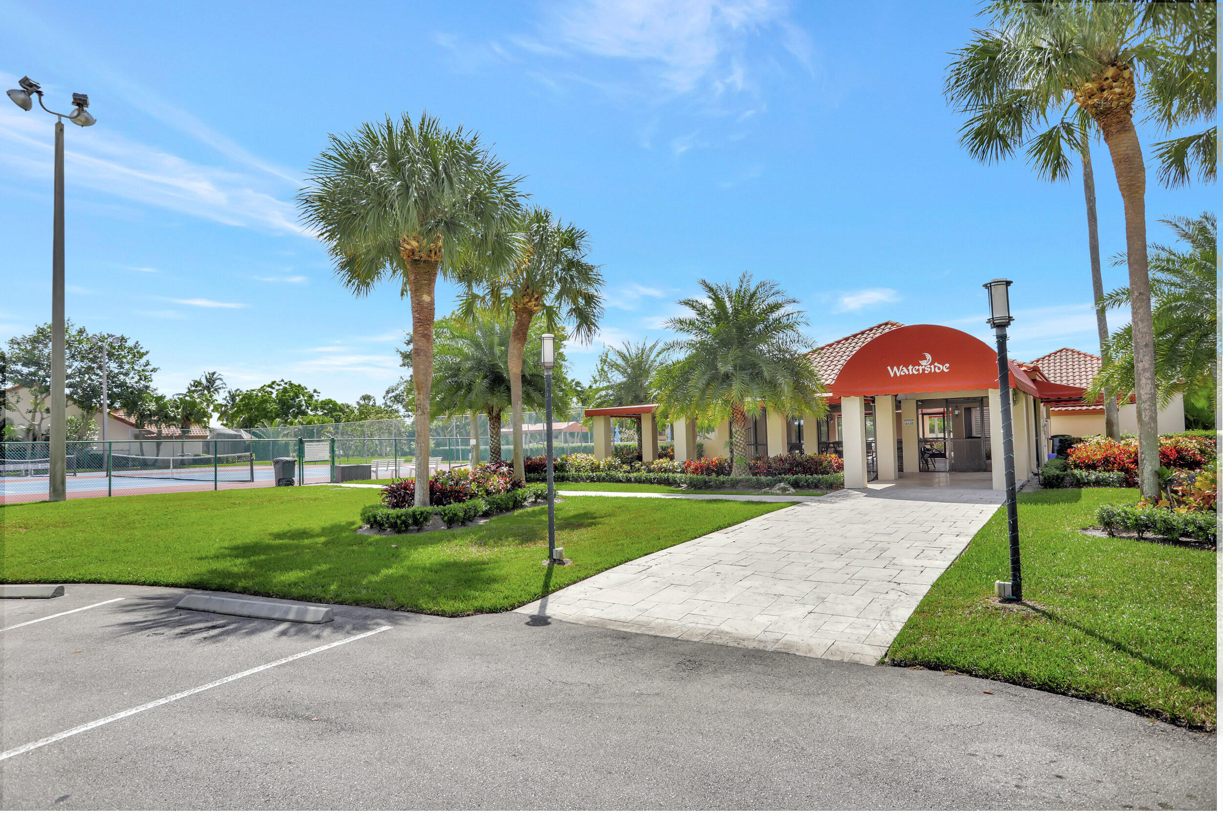 23271 Water Circle Boca Raton, FL 33486 - Photo 46 of 64 a front view of a house with garden