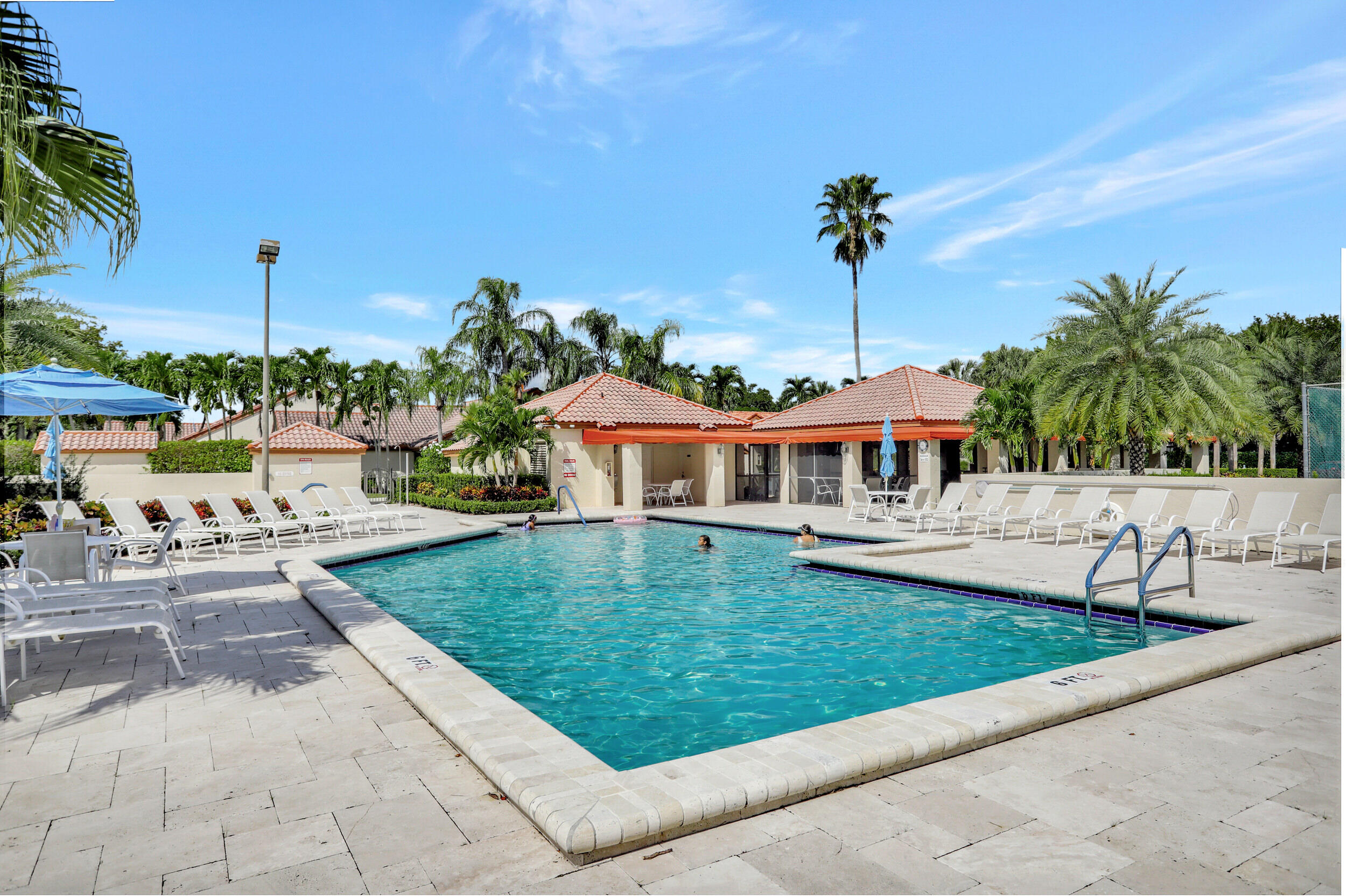 23271 Water Circle Boca Raton, FL 33486 - Photo 47 of 64 a front view of a house with garden