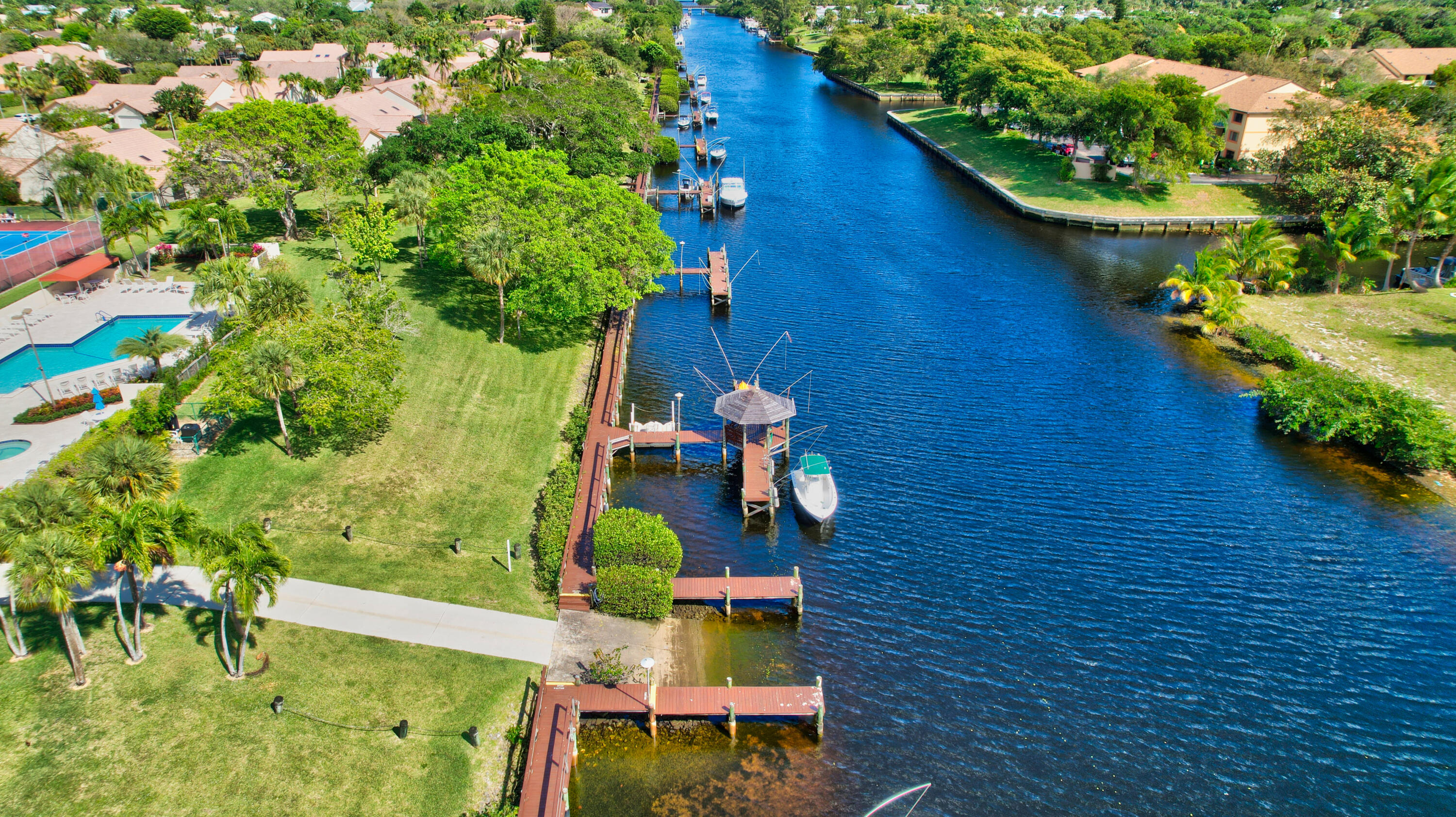 23271 Water Circle Boca Raton, FL 33486 - Photo 58 of 64 a view of a backyard with plants and a fountain