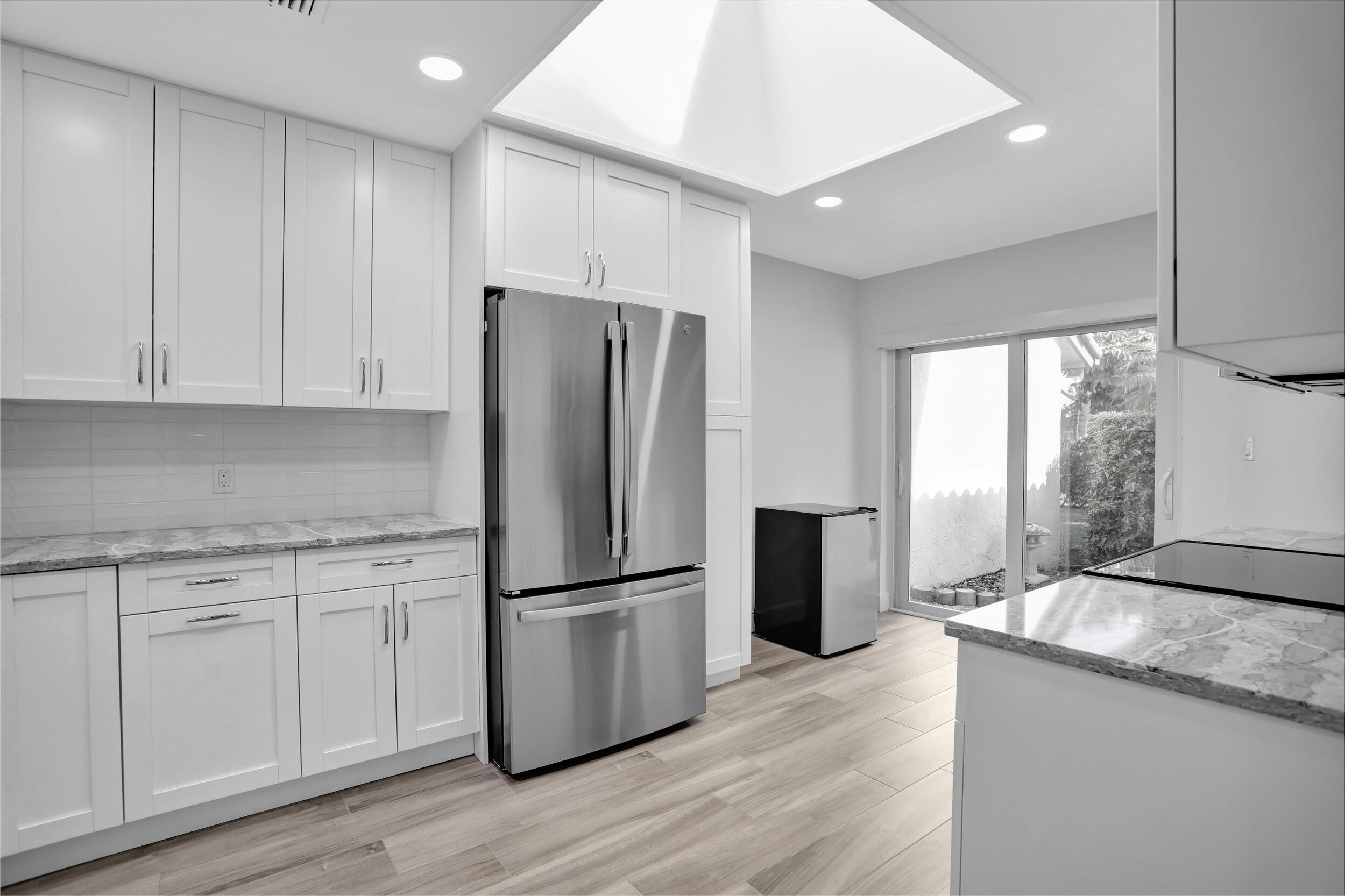 23271 Water Circle Boca Raton, FL 33486 - Photo 7 of 64 a kitchen with granite countertop appliances a sink and a refrigerator