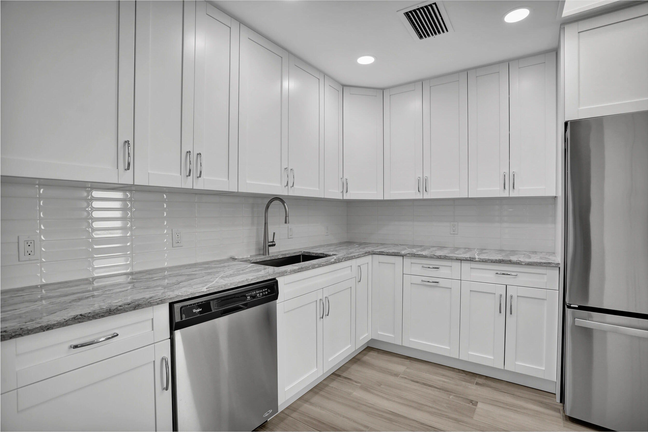 23271 Water Circle Boca Raton, FL 33486 - Photo 8 of 64 a kitchen with stainless steel appliances granite countertop a stove a sink and a refrigerator