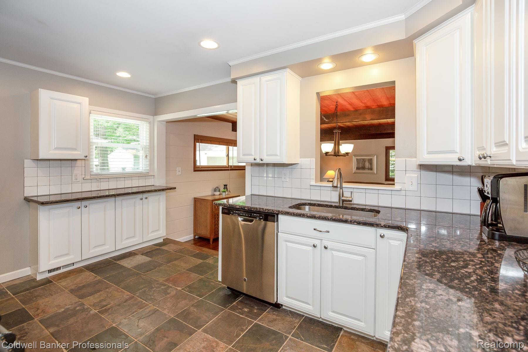 3234 Warick Road Royal Oak, MI 48073 - Photo 8 of 37 White kitchen with granite countertops and fabulous slate flooring!